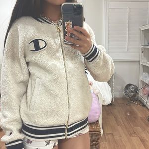 Selling champion, size small, cream/white colored, fluffy jacket